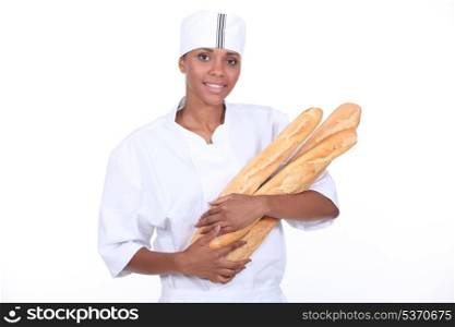 Female baker with baguette