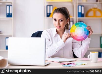 Female beautiful designer working in the office 