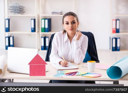 Female beautiful designer working in the office 