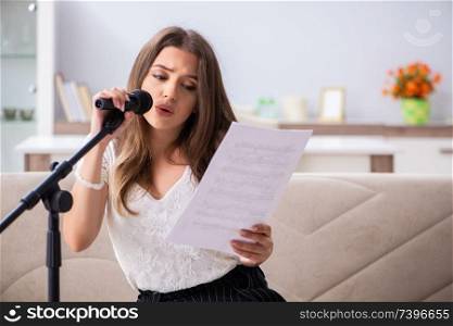 Female beautiful musician singing at home