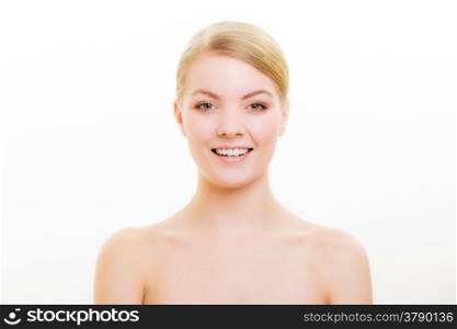 Female beauty. Portrait of blond girl with natural makeup isolated on white. Face of young woman with pure complexion and healthy smile. Skin and dental care.