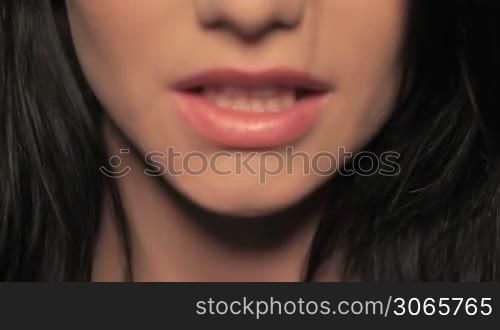 female biting lip teasing coyly seductively alluringly