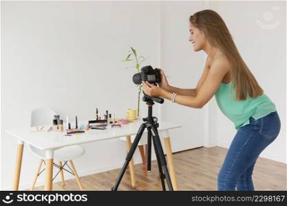 female blogger setting up camera