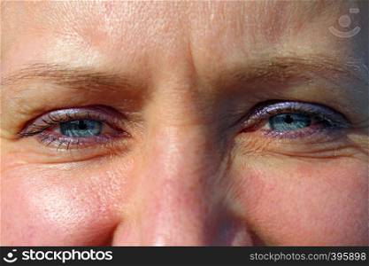 Female blue eyes. Face of attractive woman close up. Blue eyes of middle aged woman. Female blue eyes. Face of attractive woman close up