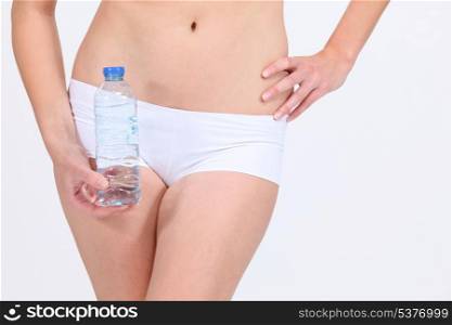 Female body with water bottle
