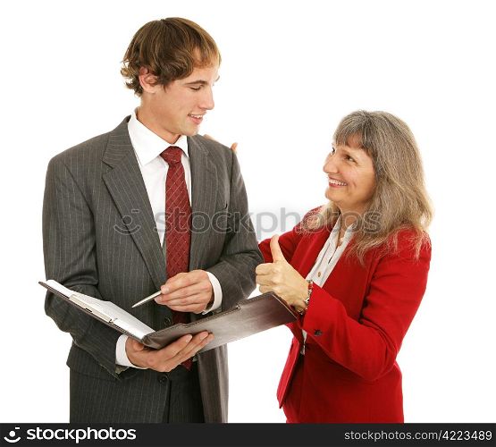 Female boss congratulating her young male employee, giving him a thumbs-up. Isolated on white.