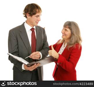 Female boss congratulating her young male employee, giving him a thumbs-up. Isolated on white.