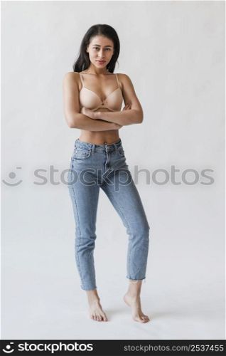 female bra denim standing with arms crossed