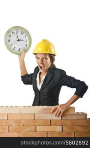 Female builder and clock on white