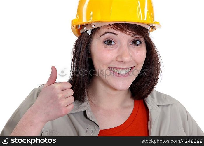Female builder giving thumbs-up