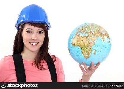 Female builder holding globe