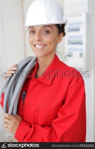 female builder holding some cables