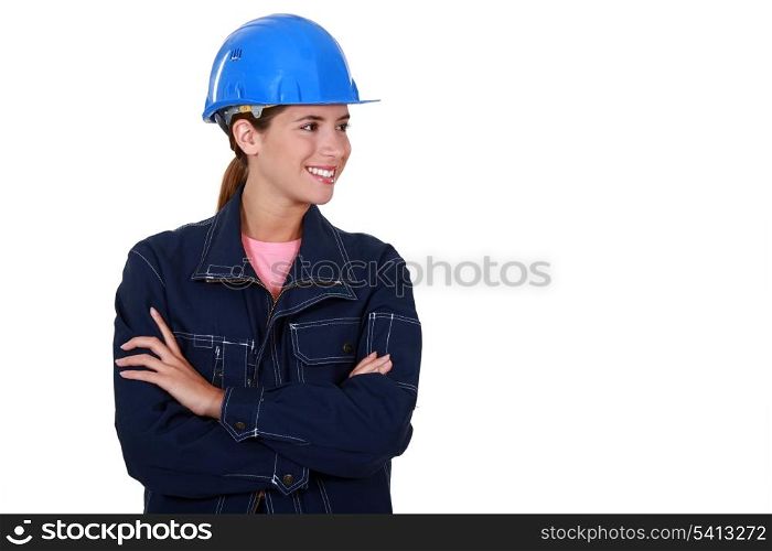 Female builder stood with folded arms