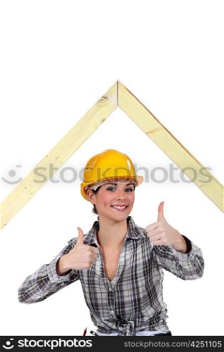 Female builder with a timber A-frame