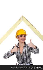 Female builder with a timber A-frame