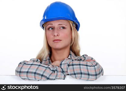 Female builder with confused look on her face