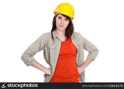 Female builder with hands on hips