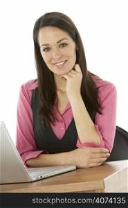 Female Businesswoman Using Laptop At Desk