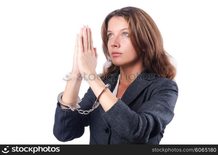 Female businesswoman with handcuffs on white