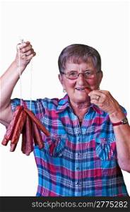 female butcher with smoked sausage