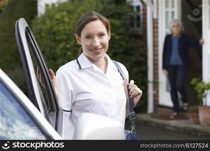 Female Care Worker Visiting Senior Woman At Home