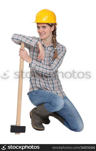 female carpenter posing with hammer
