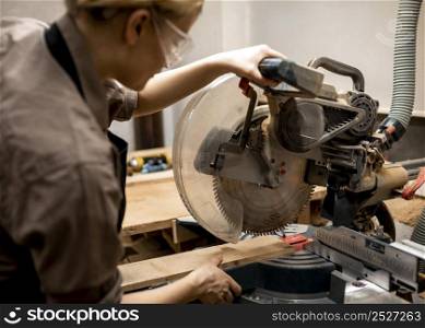 female carpenter with glasses tool