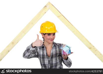 Female carpenter with money