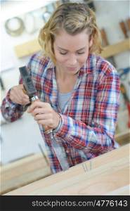 female carpenter working in workshop