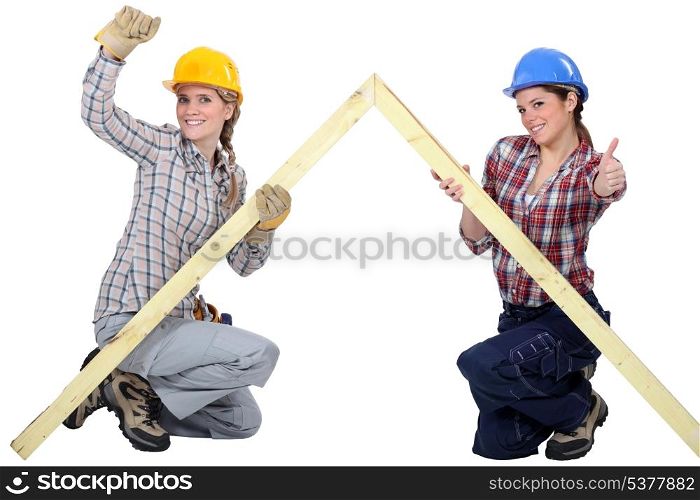 Female carpenters rejoicing