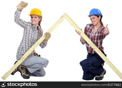 Female carpenters rejoicing