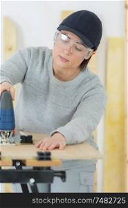 female carpentry entrepreneur working hard