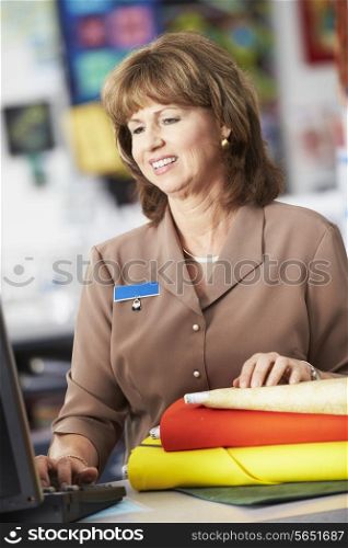 Female Cashier At Clothing Store