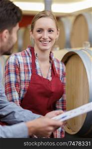 female cellar and barrel worker receiving order