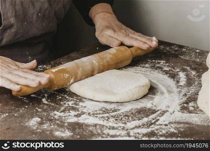 female chef using rolling pin pizza dough. High resolution photo. female chef using rolling pin pizza dough. High quality photo