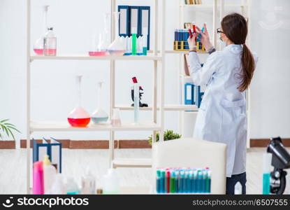 Female chemist working in hospital lab