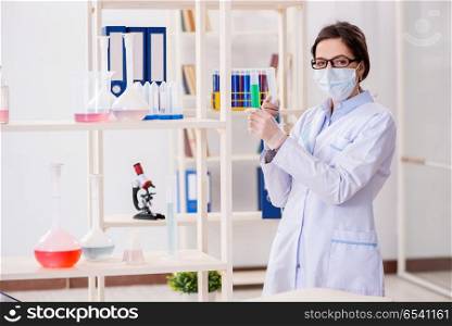 Female chemist working in hospital lab
