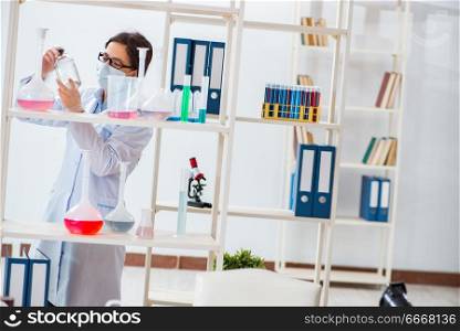 Female chemist working in hospital lab