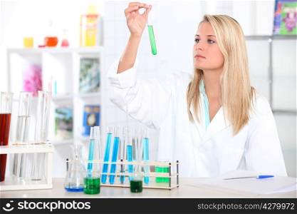 Female chemistry student with a test tube