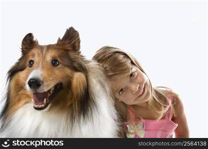 Female child Caucasian with Collie dog.