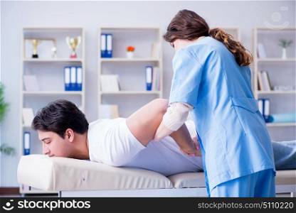 Female chiropractor doctor massaging male patient
