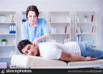 Female chiropractor doctor massaging male patient