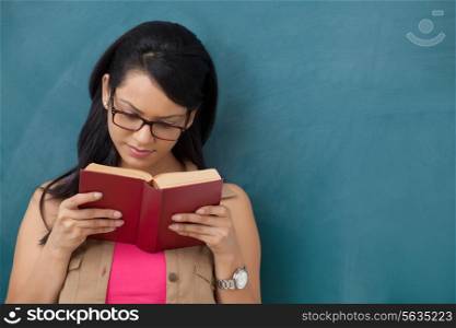Female college student reading a book