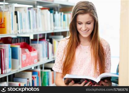 Female College Student Studying In Library