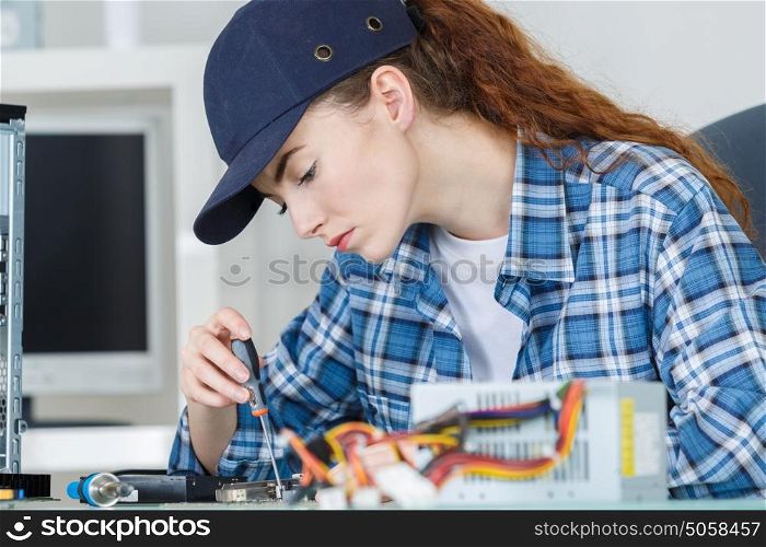 Female computer technician at work