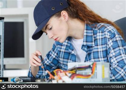 Female computer technician at work