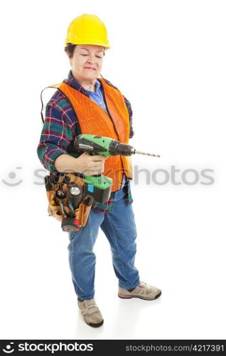 Female construction electrician using a power drill. Isolated on white background.