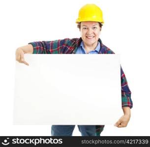 Female construction worker carrying a blank sign, ready for text. Isolated on white.