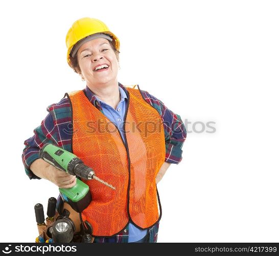 Female construction worker happy and smiling, holding her power drill. Isolated on white.