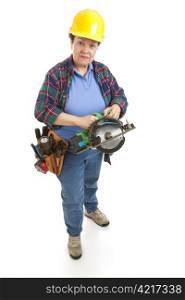 Female construction worker holding a circular power saw. Full body isolated on white.